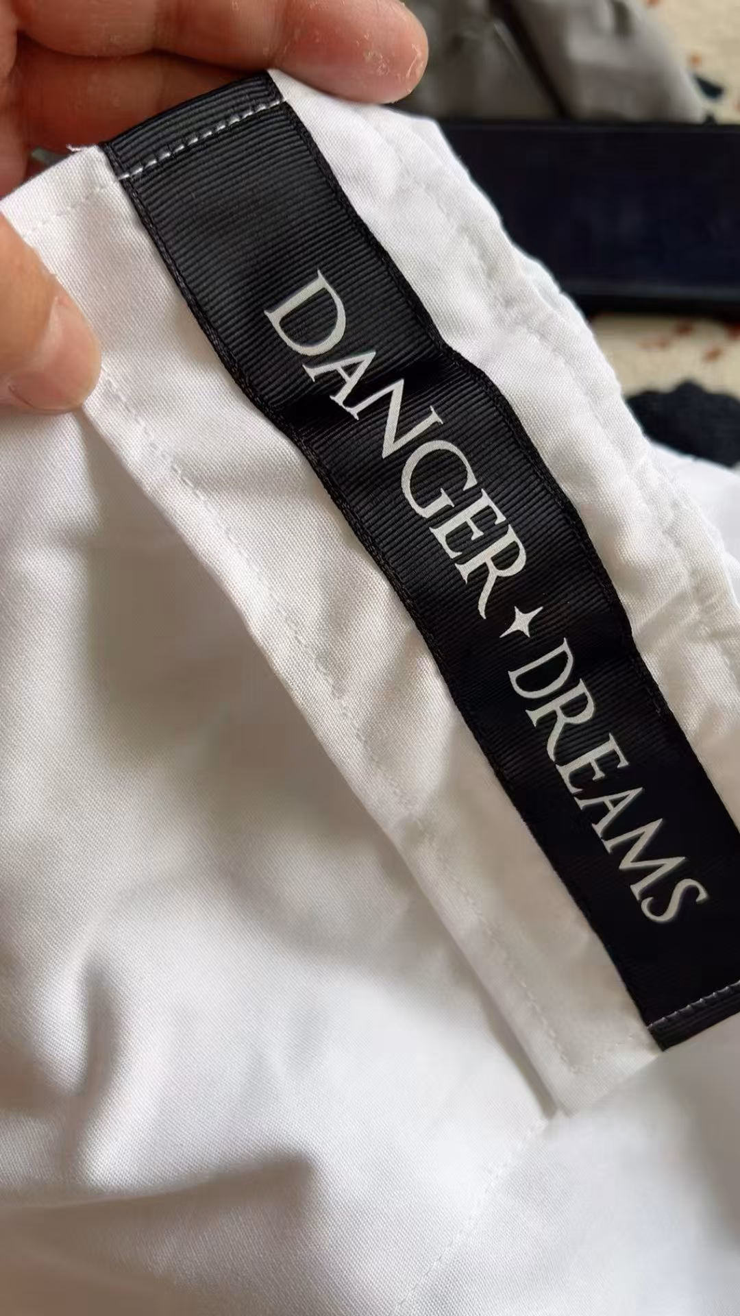 Close-up of the premium elastic waistband durable stitching and contrast panels on boys shorts