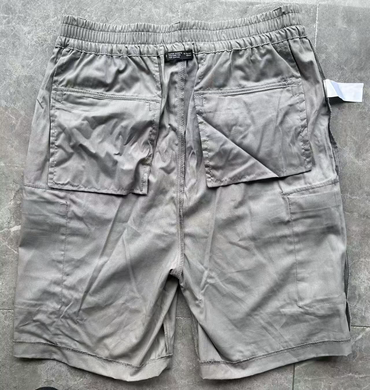 Close-up of the premium elastic waistband durable stitching and contrast panels on boys shorts