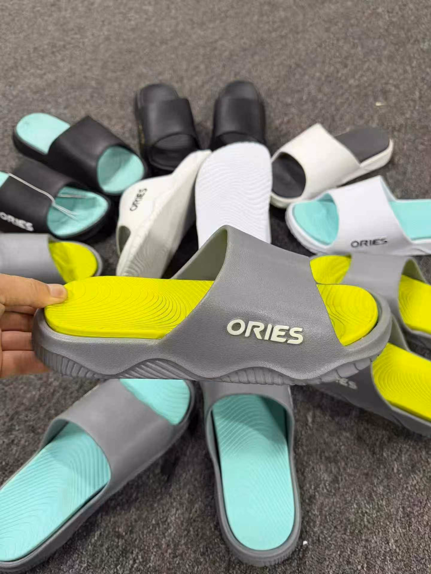 Close-up of the ergonomic footbed texture and anti-skid grip tread on men slides