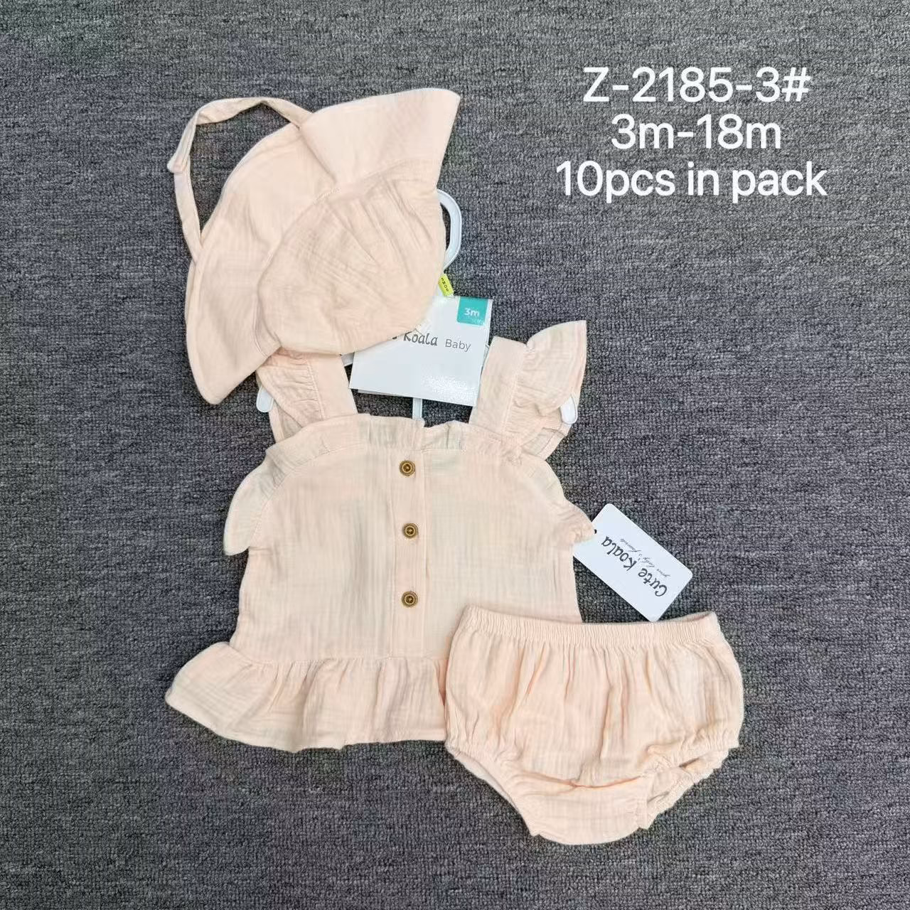 Close-up of premium double-layer cotton gauze fabric texture and delicate ruffles on baby girl summer top