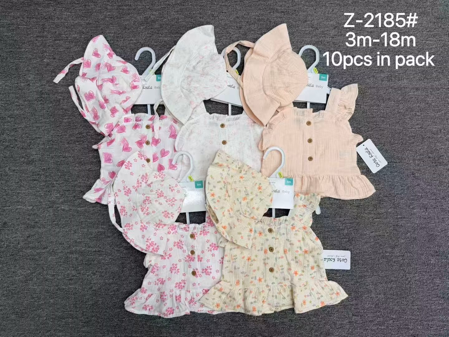 Assorted patterns display of infant muslin clothing sets packed 10pcs per pack for boutique wholesale liquidation