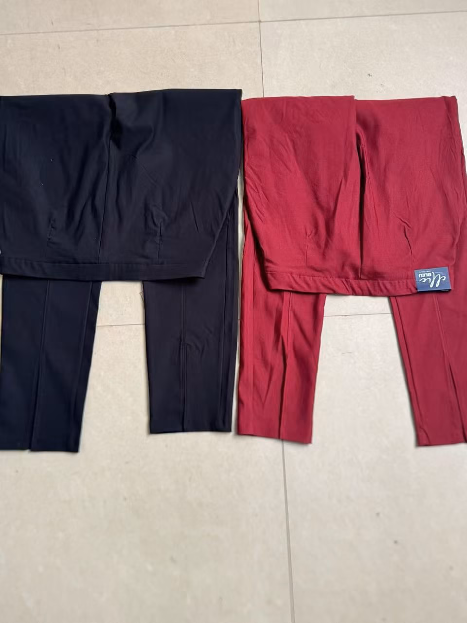 ack view of ladies light blue relaxed fit tailored pleated dress pants