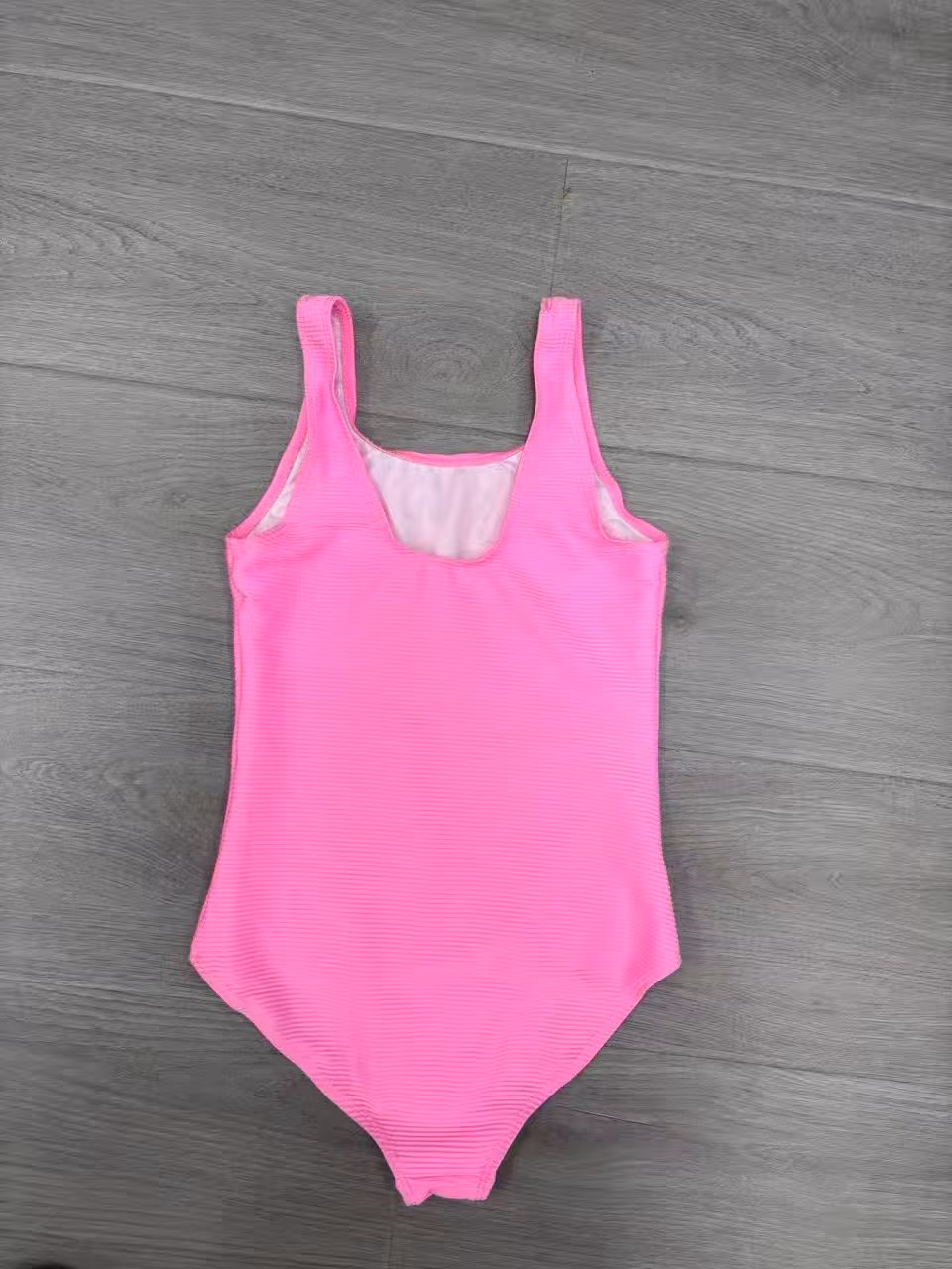 Girls hot pink one-piece swimsuit back view wholesale stocklot
