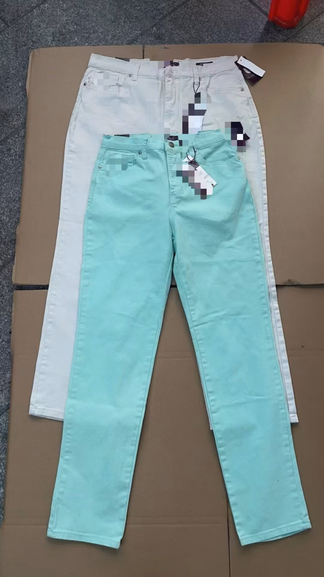 Stacked layout of girls stretch twill casual pants showcasing mint green and ivory white colorways